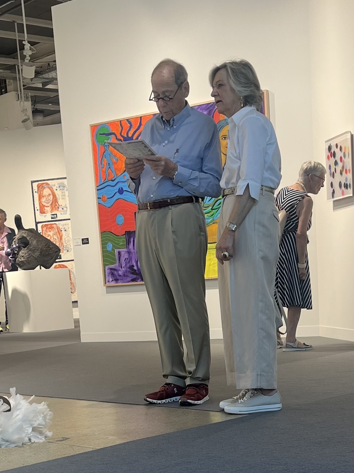 Collectors viewing contemporary art at Art Basel